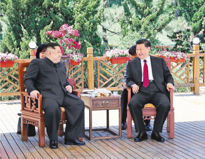 习近平同朝鲜劳动党委员长金正恩在大连举行会晤 王沪宁参加有关活动